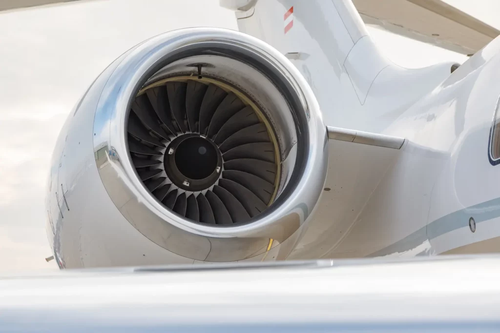 Detailed view of a Bombardier Global 5000 jet engine, highlighting the intricate turbine blades.