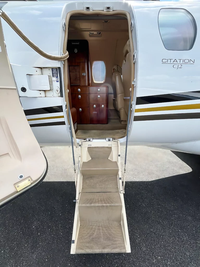 Entrance to the Cessna Citation CJ2 showing the stairs and interior.