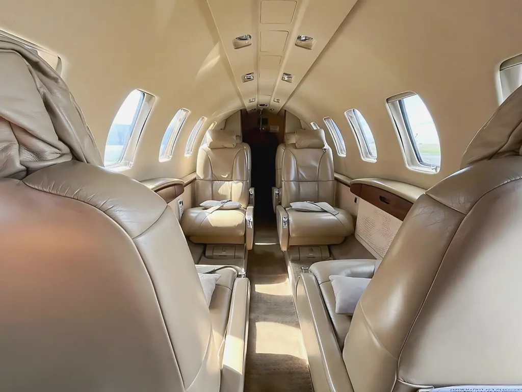 Luxurious beige leather seats inside the cabin of a Cessna Citation CJ2.