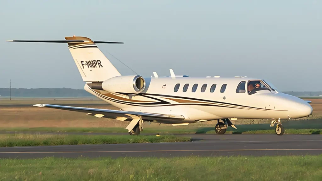 Spacious and luxurious cabin of the Cessna Citation CJ2 with beige leather seats.