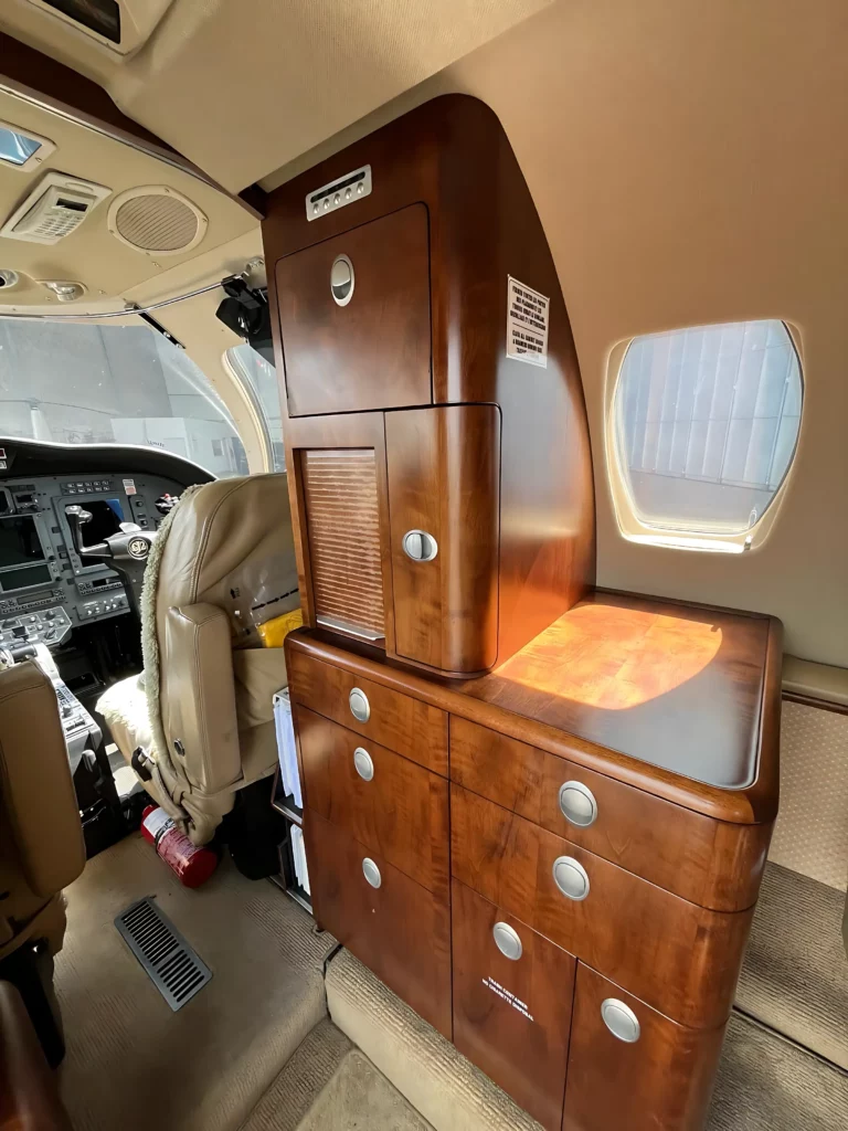 Wooden cabinetry and cockpit area inside a Cessna Citation CJ2.