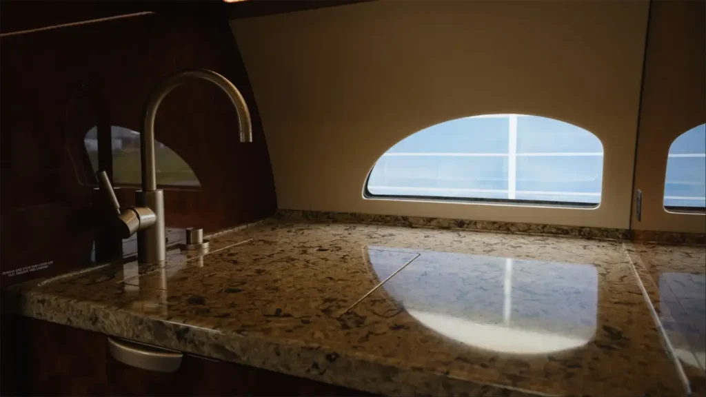 Gulfstream G500 interior galley with a polished granite countertop and modern faucet design