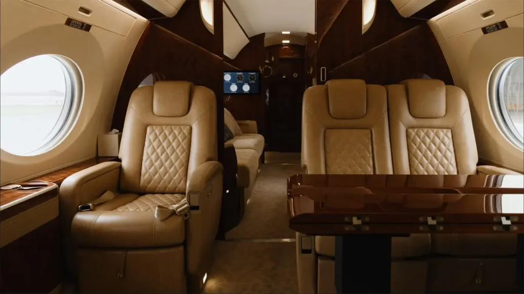 Gulfstream G500 luxury cabin with spacious seating, leather chairs, and entertainment system