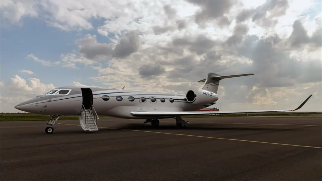 Gulfstream G500 private jet side view parked on the tarmac under cloudy skies, showcasing its elegant design