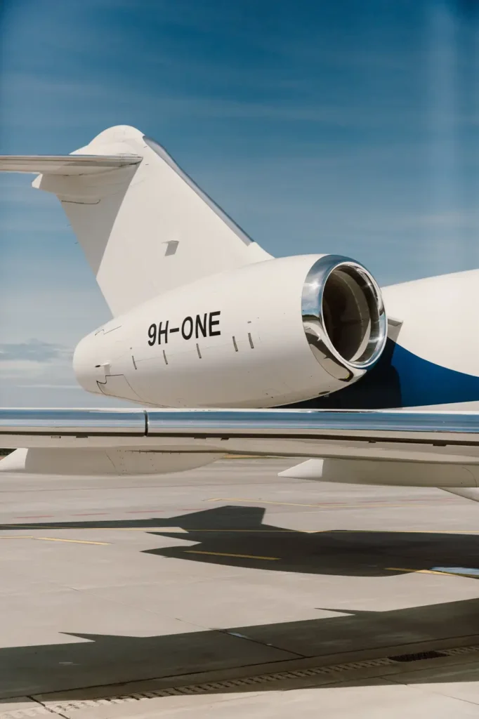 Close-up of Bombardier Global 5000 jet engine and tail section, emphasizing the aircraft's powerful design