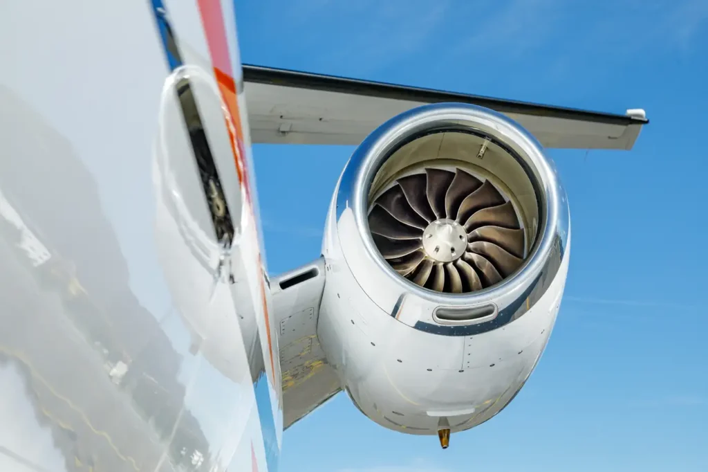 Rear view of Cessna Citation CJ3 jet engine and tail wing against blue sky