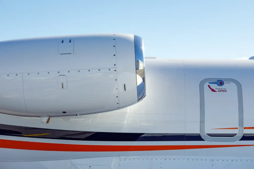 Side view of Cessna Citation CJ3 jet engine with smooth white fuselage