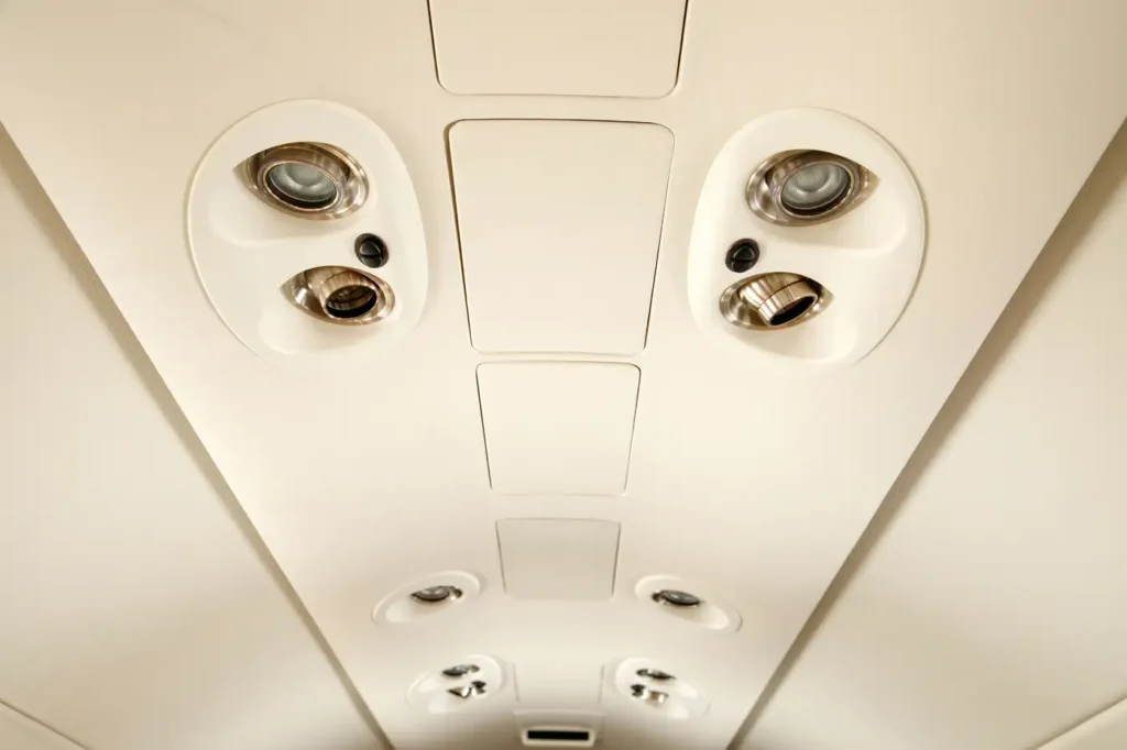 Ceiling air vents and lights inside the cabin of a Cessna Citation CJ3 private jet