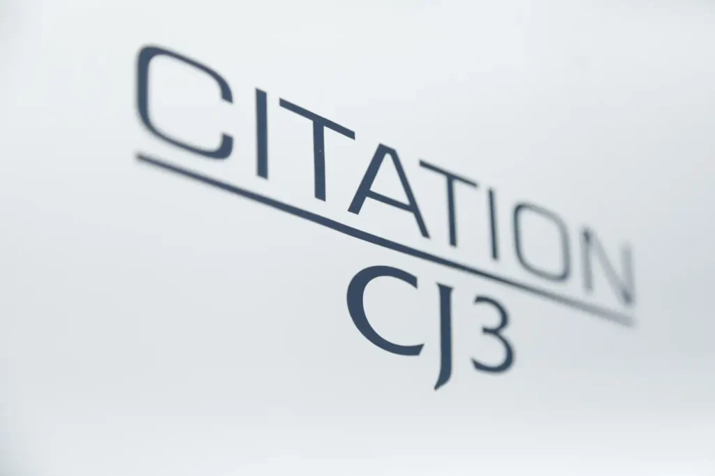 Close-up of Cessna Citation CJ3 logo on white fuselage