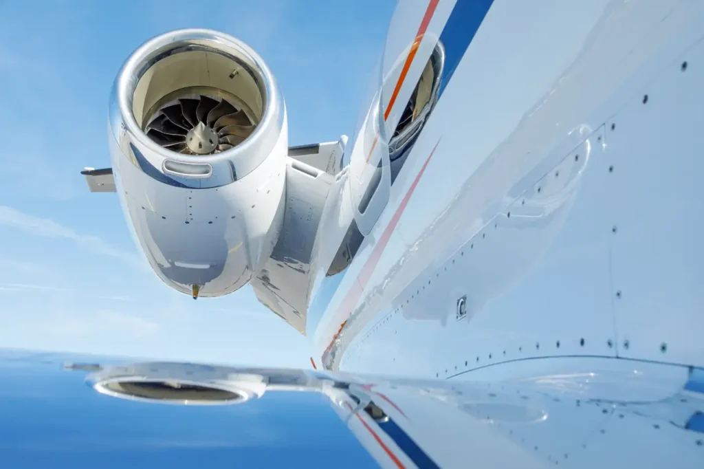 Cessna Citation CJ3 engine with sleek fuselage reflecting the clear sky