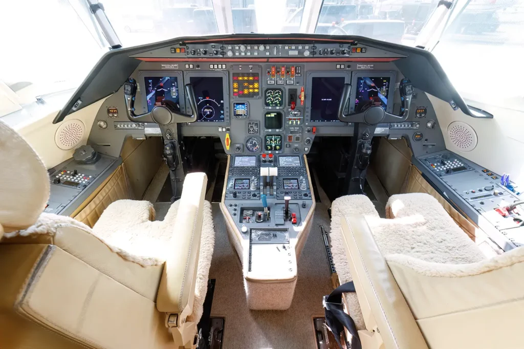 Cockpit of the Dassault Falcon 2000, equipped with advanced avionics, dual control systems, and digital displays for modern navigation and flight management.